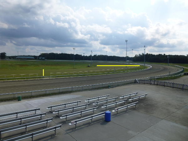 inside the dirt track for harness races, Colonial Downs has a separate grass track for Thoroughbred racing (marked by yellow lines)