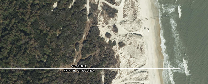 a fence, just north of the Virginia-North Carolina border, is intended to keep wild horses out of False Cape State Park