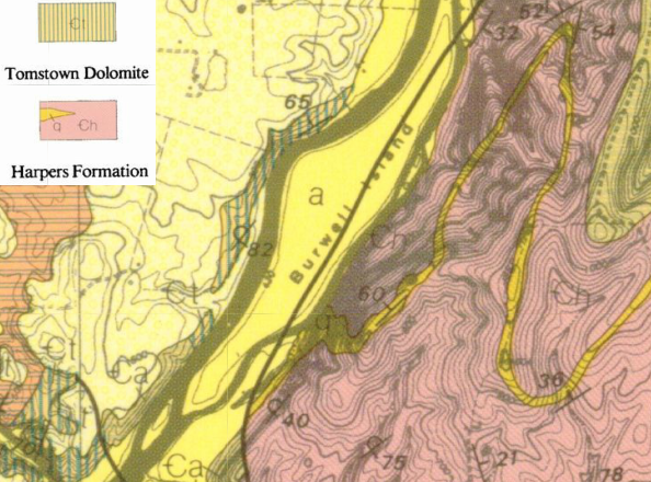 the collapsed cave opposite Burwell Island is in the limestone-rich Tomstown Dolomite to the west, not in the Harpers Formation sandstone to the east of the island