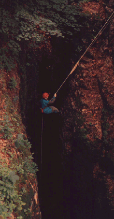 rappelling into a 75-foot Banes Drop in Newberry-Banes Cave System and Pig Hole Cave