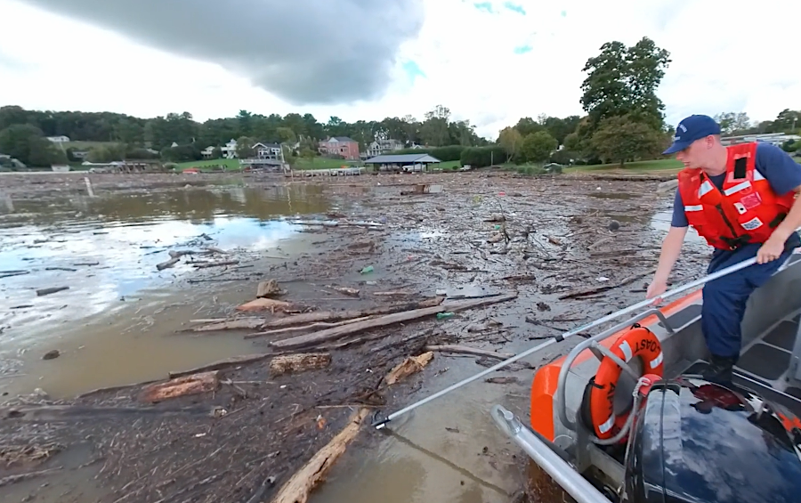 United States Coast Guard Auxiliary volunteers, including Virginia Tech students, helped clear debris from Claytor Lake brought down the New River by rainfall from Hurricane Helene