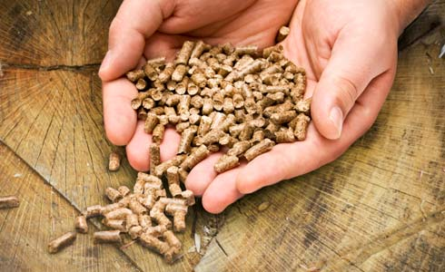 pellets are produced by chipping, drying, and compressing wood to create a fuel with higher energy density than raw wood waste