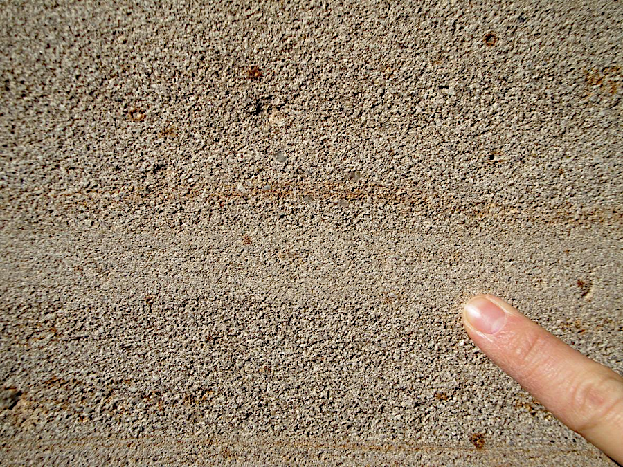 Aquia sandstone is a sedimentary rock, composed primarily of grains of silica and feldspar