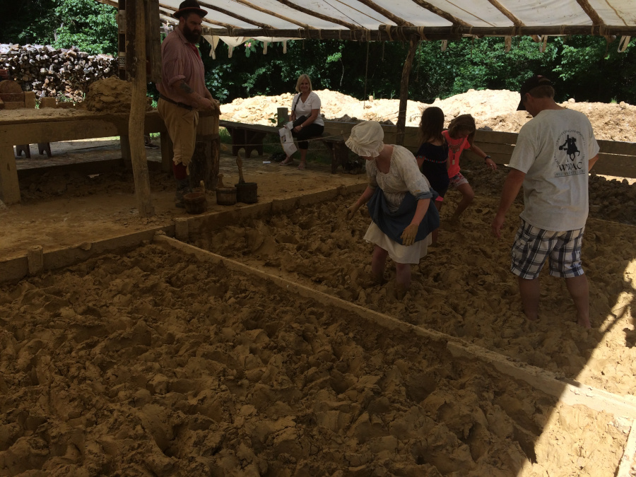 at Colonial Williamsburg, tourists can process the clay used for making bricks