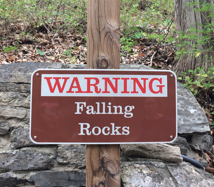 a warning sign alerts visitors to Natural Bridge that rockfalls are possible