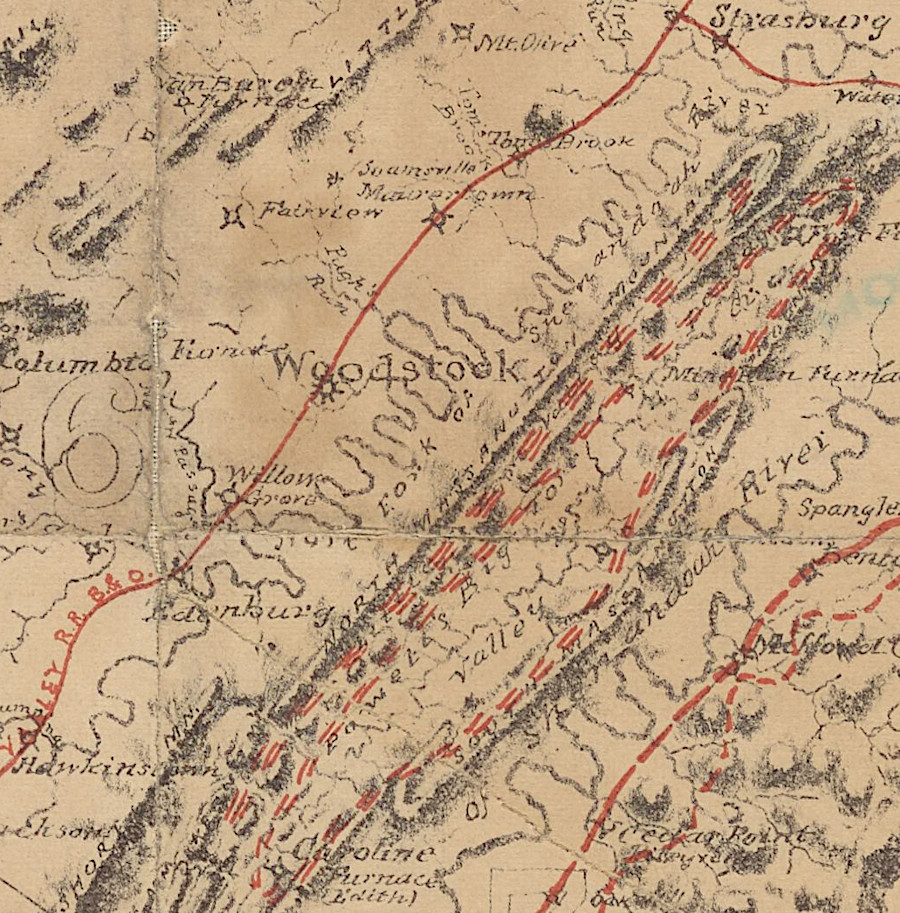 the Valley Railroad and the Shenandoah Valley Railroad both planned to gain freight traffic from iron deposits (red dashes) in Massanutten Mountain