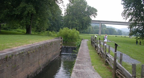 historic James River and Kanawha Canal lock, with modern Blue Ridge Parkway bridge in background (Bedford County)