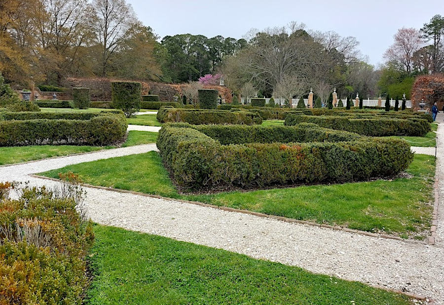 wealthy Virginians in the 1700's created turf and garden landscapes around brick mansions - including the Governor's Palace in Williamsburg