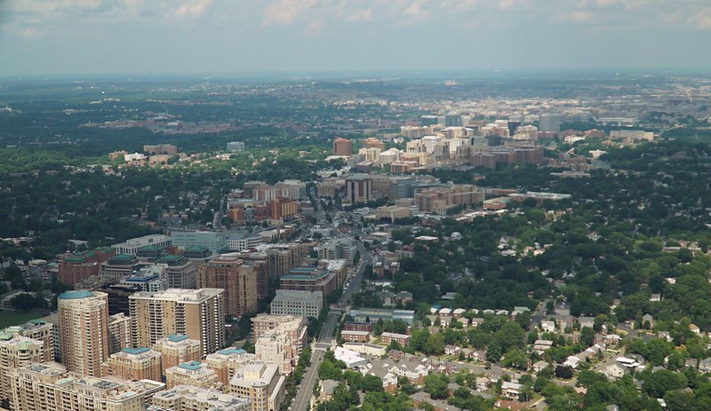 Arlington County preserved low-density neighborhoods by concentrating new development in the Rosslyn-Ballston corridor, accommodating population/job growth in high-rise buildings next to Metrorail stations