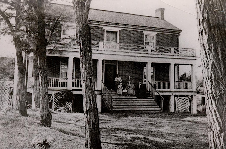 in August 1865, Wilmer McLean and his family posed on the porch of their house where General Lee surrendered to General Grant