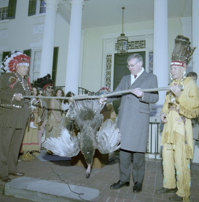 two members of the Pamunkey Indian tribe ceremonially delivered the annual payment of tribute to Gov. Baliles in 1989