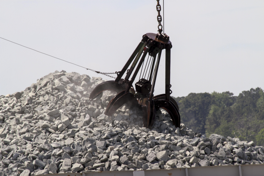 moving granite from barge to the bottom of the Piankatank River, to provide oysters a base for building a new reef