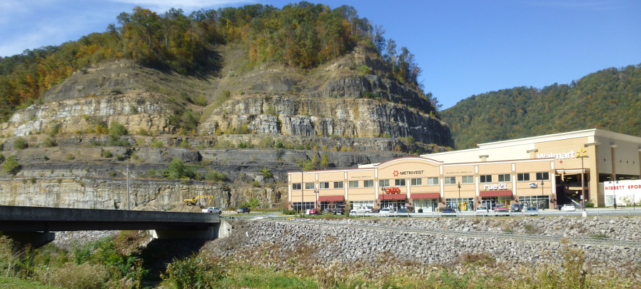 a flood control project and expansion of US460 relocated downtown Grundy across the Levisa Fork, and a Wal*Mart is now the primary retail outlet in a three-story building that replaced the distinctive old structures