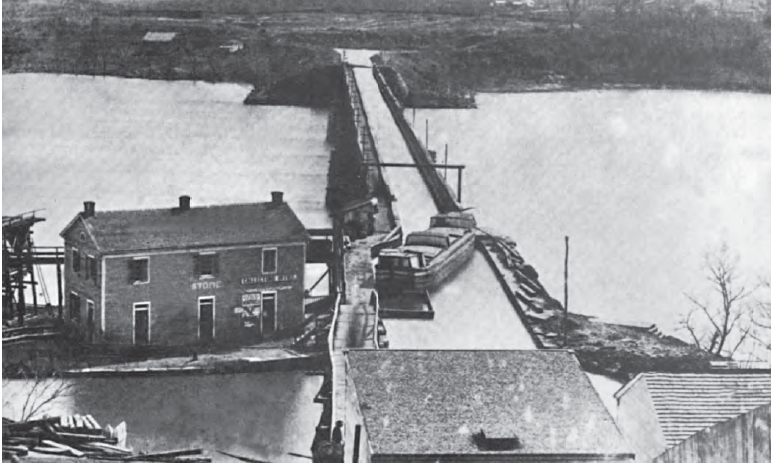 barge using the Aqueduct Bridge across the Potomac River