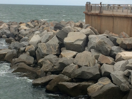 to limit erosion, massive chunks of granite armor the shorelines of the four artificial islands on the Chesapeake Bay Bridge-Tunnel