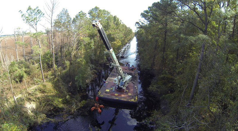a crane barge removed downed trees in the feeder ditch after Hurricane Mathew in 2016