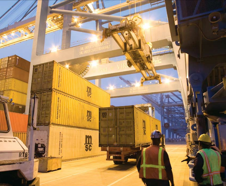 gantry cranes move containers from ships to chassis bodies on the wharves, and the chassis bodies are then moved to a location where containers can be loaded onto trucks or rail cars
