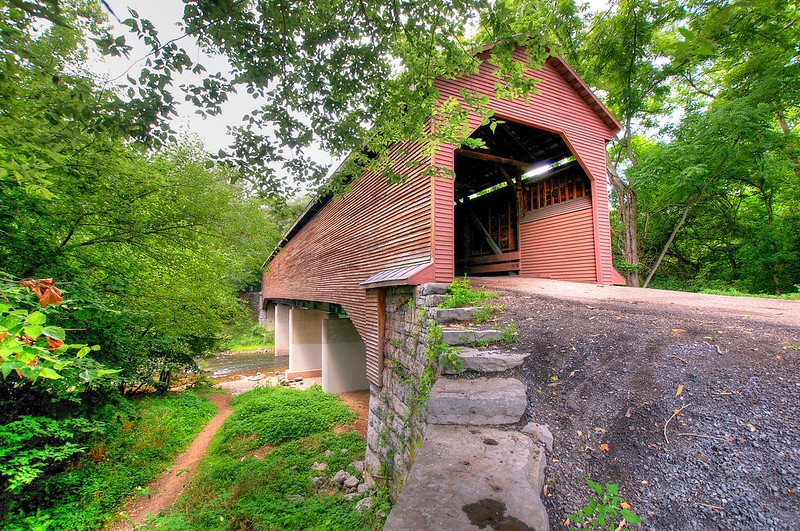 the Virginia Department of Transportation rebuilt Meems Bottom Covered Bridge, with concrete piers and steel girders, after arsonists burned the historic covered bridge in 1976