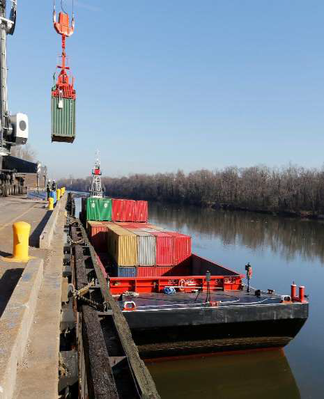 barges bring cargo containers up the James River to the Port of Richmond