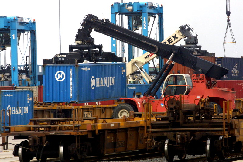 at Norfolk International Terminals (NIT) and Virginia International Gateway (VIG), containers are unloaded from ships and double-stacked onto trains