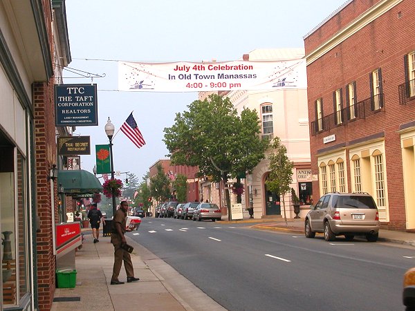 banners over Center Street in downtown Manassas alert commuters about reasons to return and spend money in Manassas