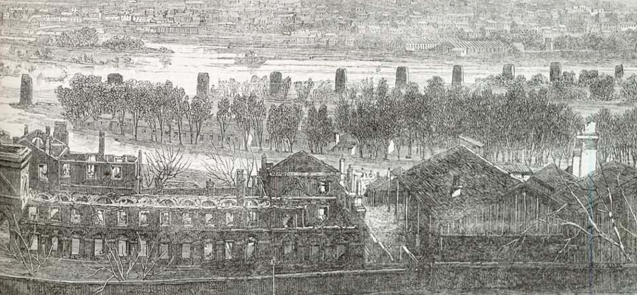 looking from the James River and Kanawha Canal past the burned-out Richmond Arsenal to the destroyed Richmond and Petersburg Railroad bridge after the Evacuation Fire in 1865