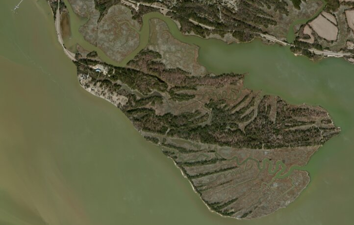 Jamestown was built on an peninsula that was connected to the mainland at the northwest corner, but storms have washed away/expanded that peninsula (a causeway provides road access now)