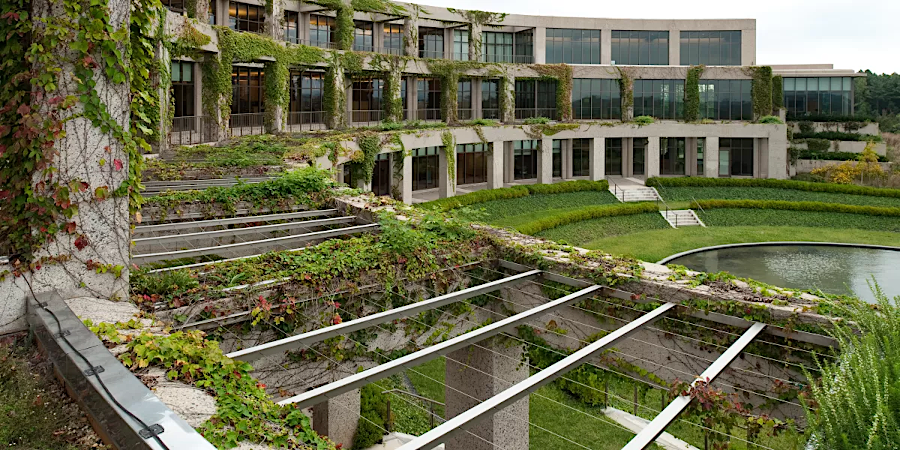 most of the Packard Center is underneath a green roof, except for the main entryway and west front of the Conservation Building