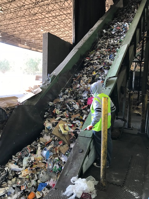 sorting material in Chester at a material recycling facility, separating paper, plastic, glass, and metal
