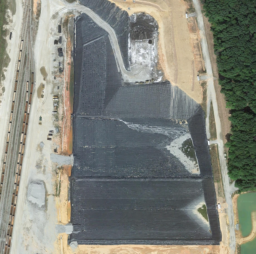 black geotextile fabric lines a new cell at the Maplewood (Amelia) Landfill, ready for delivery of waste by rail