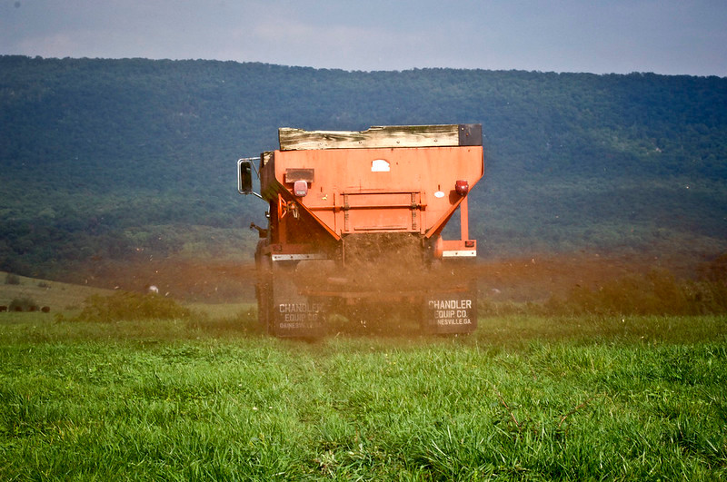 farmers in Rockingham County spreading poultry litter in their fields in September 2008