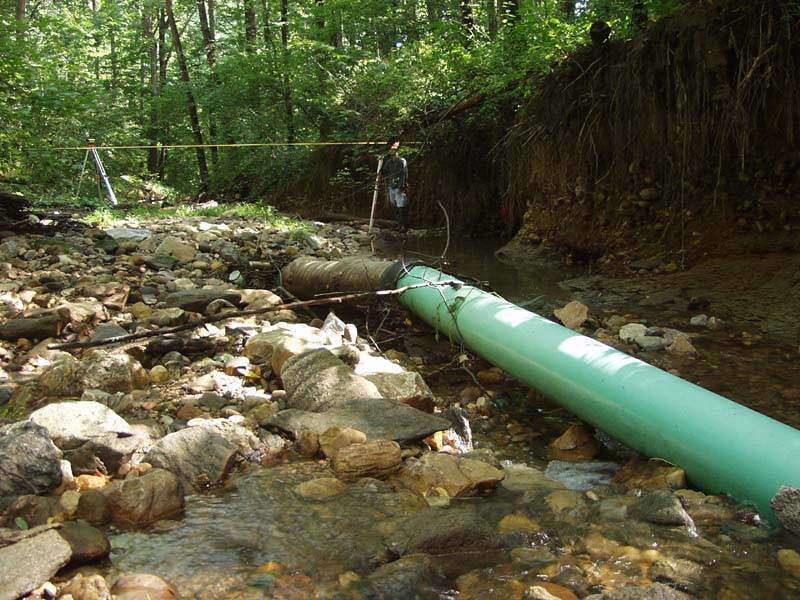 a stream restoration project may be triggered by exposure of buried sewer and water lines